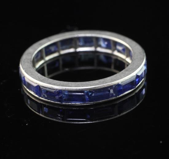 A white metal and sapphire full eternity ring, size K.